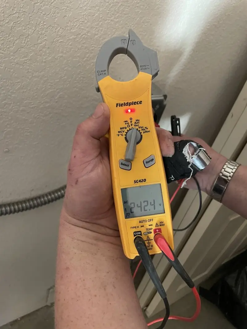 Voltage testing with clamp meter during Electrical Installation Services in Fremont